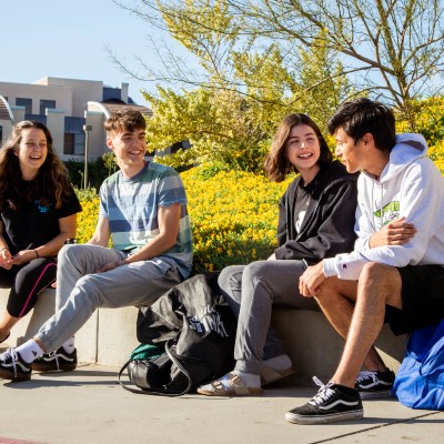 Student chatting on campus.